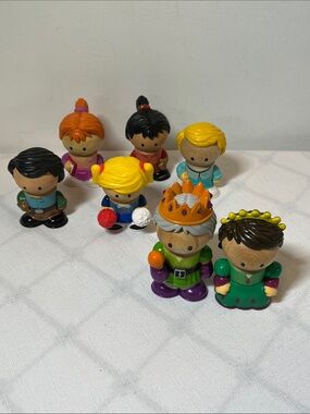 Learning Curve Play Town figures
wooden bodies and plastic accessories